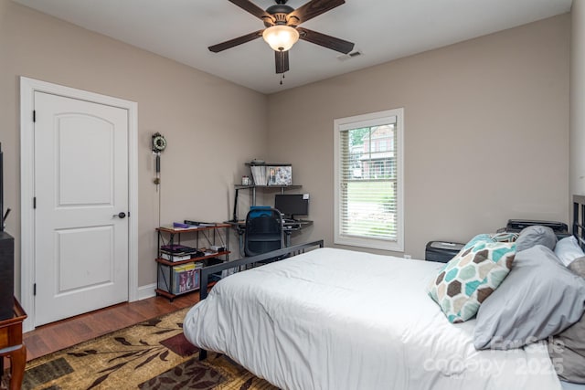 bedroom featuring wood finished floors and a ceiling fan