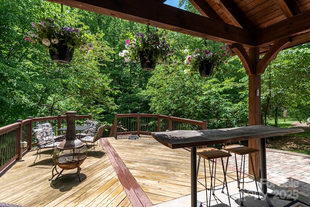 deck featuring a fire pit and a gazebo