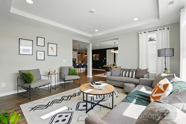 2062 Nellies Way, Fort Mill, SC 29715 - living area featuring a tray ceiling, a chandelier, wood finished floors, baseboards, and recessed lighting