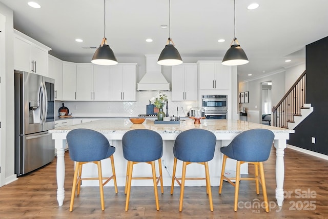 2062 Nellies Way, Fort Mill, SC 29715 - kitchen featuring appliances with stainless steel finishes, custom exhaust hood, recessed lighting, backsplash, and white cabinetry