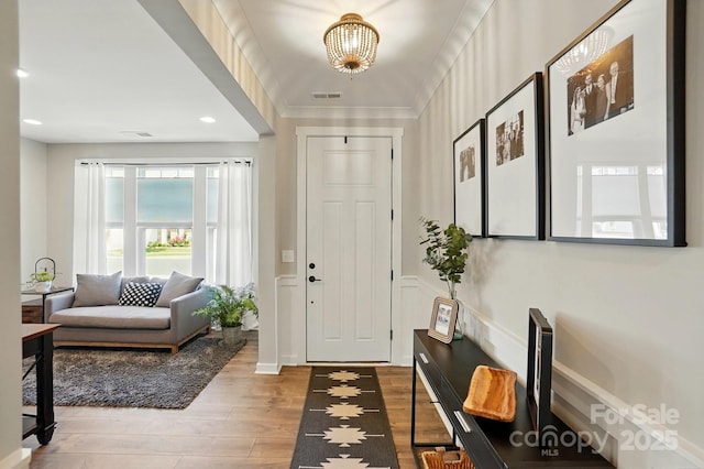 2062 Nellies Way, Fort Mill, SC 29715 - entryway featuring wood finished floors, a chandelier, a decorative wall, and recessed lighting
