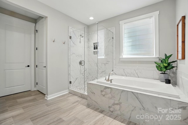 2062 Nellies Way, Fort Mill, SC 29715 - full bath with a stall shower, a bath, baseboards, recessed lighting, and wood finished floors