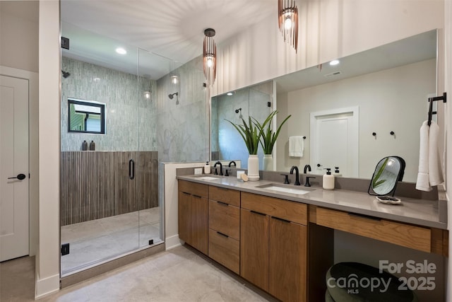 bathroom with a shower stall, double vanity, tile patterned flooring, and recessed lighting