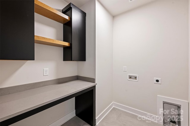 laundry room featuring hookup for an electric dryer, washer hookup, cabinet space, and baseboards