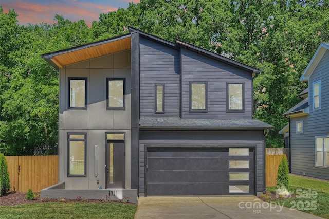 1711 Summey Ave, Charlotte, NC 28205 - modern home featuring concrete driveway and an attached garage