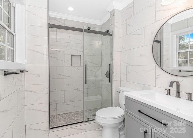 full bathroom with marble finish flooring, ornamental molding, a shower stall, toilet, and vanity