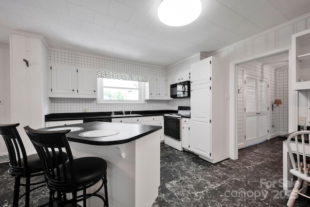 kitchen with electric stove, black microwave, a sink, dark countertops, and white cabinetry