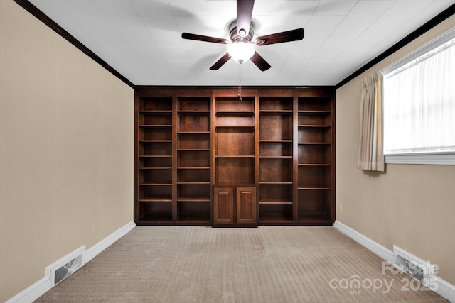 empty room featuring carpet flooring, a ceiling fan, and baseboards