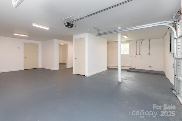 1318 Crawford Rd, Waynesville, NC 28785 - garage with a garage door opener and baseboards