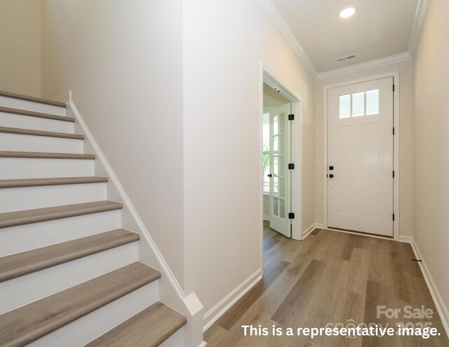 17033 Malone Ln, Mint Hill, NC 28227 - entrance foyer with stairs, wood finished floors, crown molding, baseboards, and recessed lighting