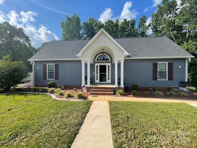 517 Grassy Creek Run, Chester, SC 29706 - ranch-style house featuring a front yard, board and batten siding, a shingled roof, and a porch