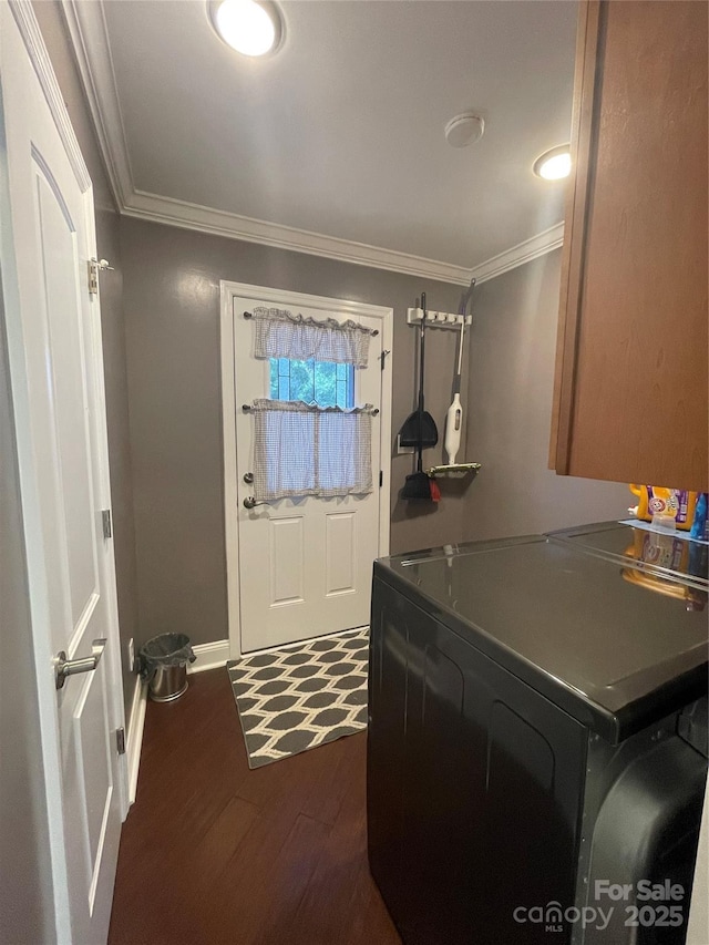 517 Grassy Creek Run, Chester, SC 29706 - clothes washing area with cabinet space, ornamental molding, baseboards, dark wood-type flooring, and washer and clothes dryer