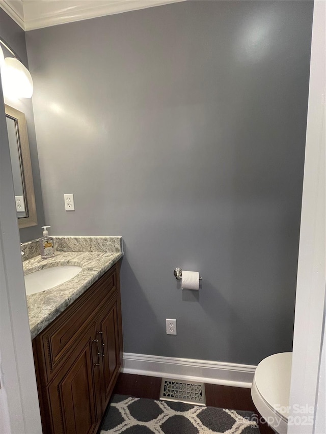 517 Grassy Creek Run, Chester, SC 29706 - half bath featuring baseboards, ornamental molding, vanity, and toilet