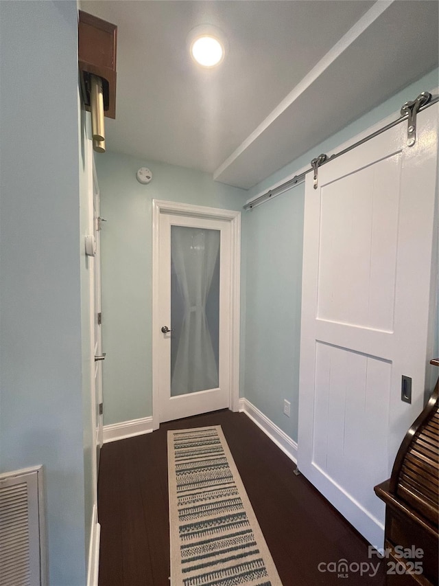 517 Grassy Creek Run, Chester, SC 29706 - hall with dark wood-style flooring, baseboards, and a barn door