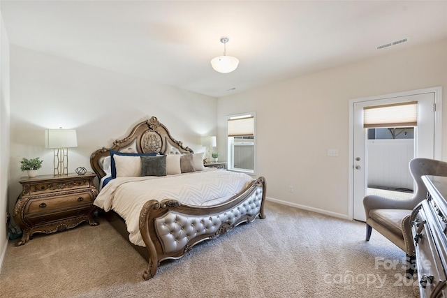 carpeted bedroom with multiple windows and baseboards