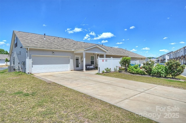 ranch-style house with an attached garage, driveway, a shingled roof, and central air condition unit