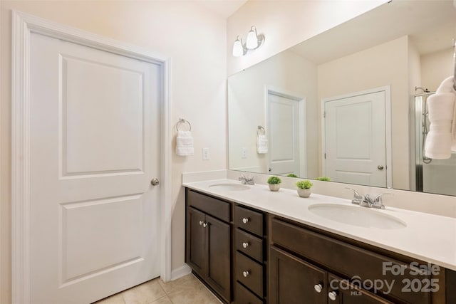 bathroom featuring double vanity and tile patterned floors