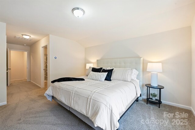 bedroom with carpet and baseboards