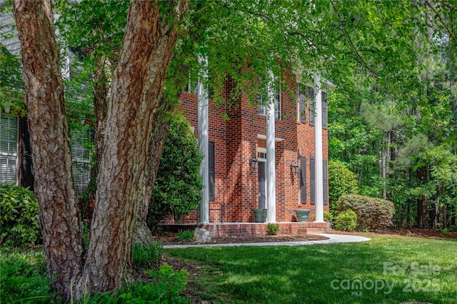 exterior space with brick siding
