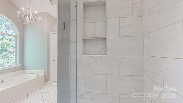 full bath featuring plenty of natural light, a tile shower, and a garden tub
