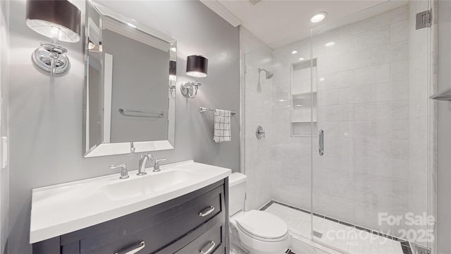 full bath featuring a shower stall, toilet, vanity, and recessed lighting