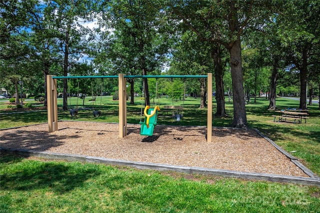 community play area with a lawn