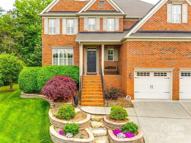 208 Mcduffie Ln, Fort Mill, SC 29715 - view of front facade with brick siding, concrete driveway, a garage, and a shingled roof