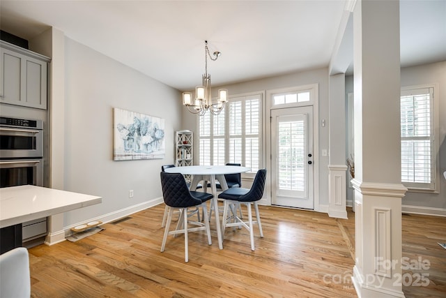 208 Mcduffie Ln, Fort Mill, SC 29715 - dining space with light wood-style floors, a chandelier, and baseboards