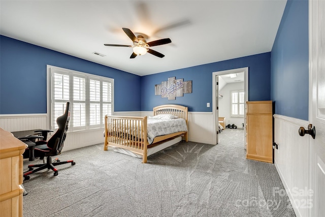 208 Mcduffie Ln, Fort Mill, SC 29715 - bedroom featuring wainscoting, carpet flooring, an office area, and ceiling fan