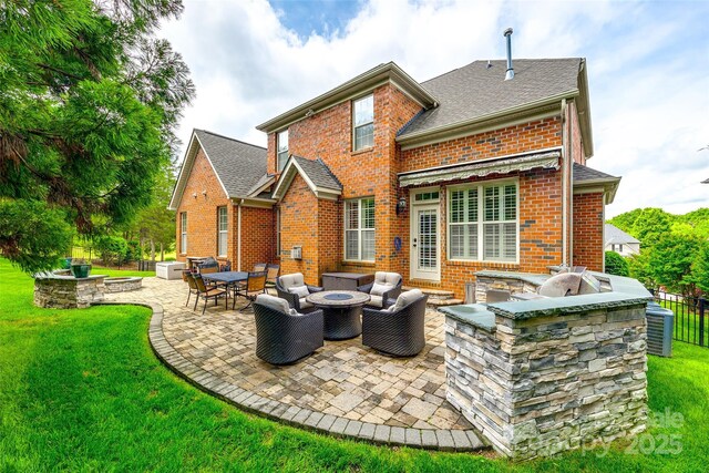 208 Mcduffie Ln, Fort Mill, SC 29715 - rear view of property with an outdoor fire pit, area for grilling, and brick siding