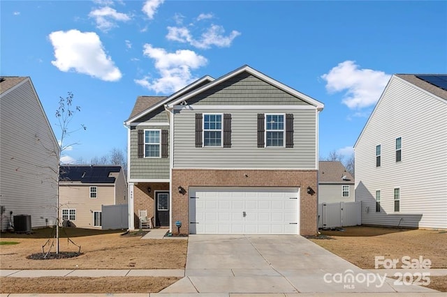 view of front of home featuring driveway, a garage, brick siding, central AC, and fence