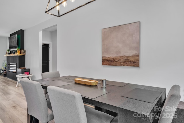 5262 Mckenzie Trl, Conover, NC 28613 - dining room featuring light wood finished floors and a chandelier
