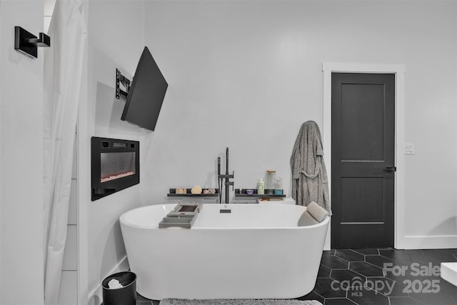 5262 Mckenzie Trl, Conover, NC 28613 - bathroom with baseboards, a soaking tub, and tile patterned flooring