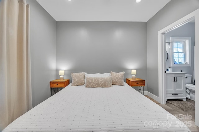 5262 Mckenzie Trl, Conover, NC 28613 - bedroom with wood finished floors, recessed lighting, baseboards, and ensuite bathroom