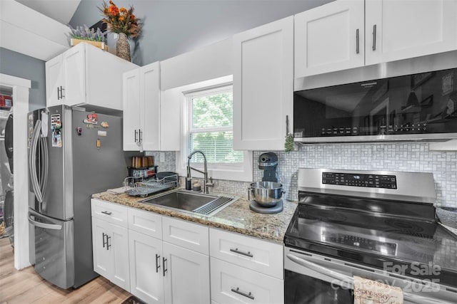 5262 Mckenzie Trl, Conover, NC 28613 - kitchen with stainless steel appliances, a sink, light wood finished floors, and white cabinetry