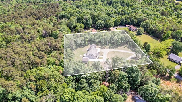 5262 Mckenzie Trl, Conover, NC 28613 - aerial view of property and surrounding area featuring a heavily wooded area and property boundaries highlighted