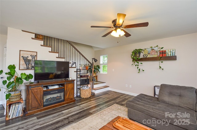8024 Eagle St, Mount Pleasant, NC 28124 - living room with stairs, wood finished floors, a ceiling fan, and baseboards