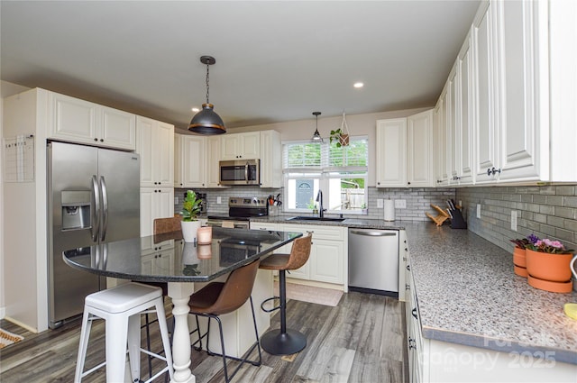 8024 Eagle St, Mount Pleasant, NC 28124 - kitchen featuring appliances with stainless steel finishes, a sink, decorative backsplash, white cabinets, and recessed lighting