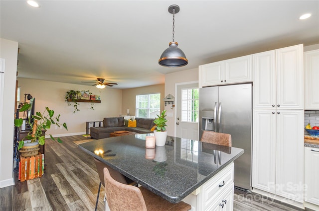 8024 Eagle St, Mount Pleasant, NC 28124 - kitchen featuring stainless steel fridge, baseboards, white cabinetry, recessed lighting, and wood finished floors