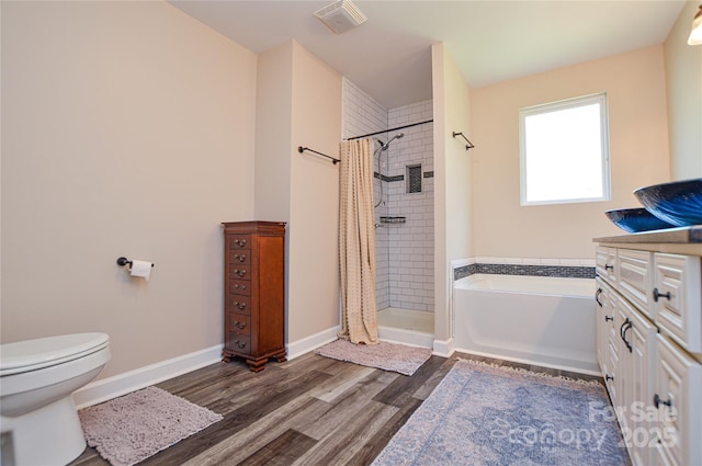 8024 Eagle St, Mount Pleasant, NC 28124 - full bathroom with a shower stall, wood finished floors, toilet, a bath, and baseboards