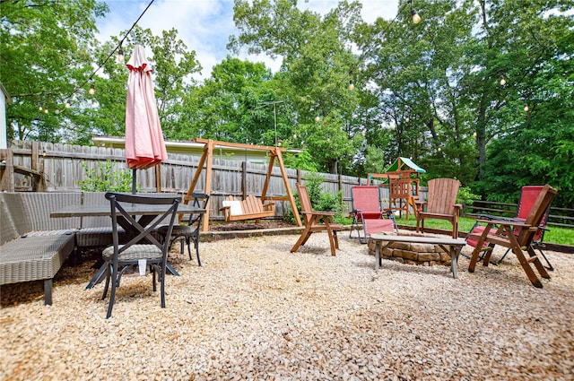 8024 Eagle St, Mount Pleasant, NC 28124 - fenced backyard with a fire pit and view of scattered trees