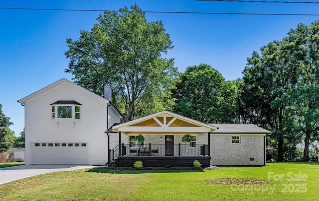 139 Elysian Dr, Mooresville, NC 28117 - view of front of house with a garage, driveway, a front yard, and a chimney