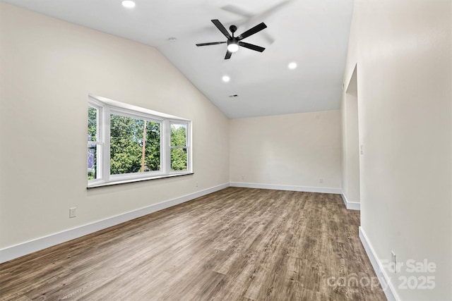 139 Elysian Dr, Mooresville, NC 28117 - spare room featuring wood finished floors, ceiling fan, lofted ceiling, recessed lighting, and baseboards