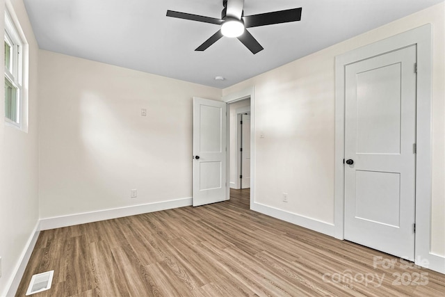 139 Elysian Dr, Mooresville, NC 28117 - unfurnished bedroom with light wood-type flooring, baseboards, and a ceiling fan
