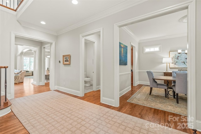6831 Conservatory Ln, Charlotte, NC 28210 - corridor featuring plenty of natural light, crown molding, wood finished floors, baseboards, and recessed lighting
