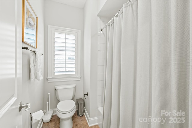6831 Conservatory Ln, Charlotte, NC 28210 - bathroom with toilet, tile patterned floors, baseboards, and shower / bathtub combination with curtain