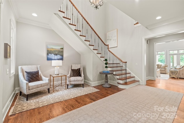 6831 Conservatory Ln, Charlotte, NC 28210 - sitting room featuring wood finished floors, stairway, ornamental molding, baseboards, and recessed lighting