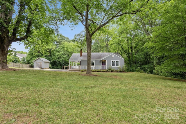 500 Peigler St NW Unit 1 & 2, Concord, NC 28027 - view of front of house featuring a porch, a storage shed, a chimney, and an outbuilding