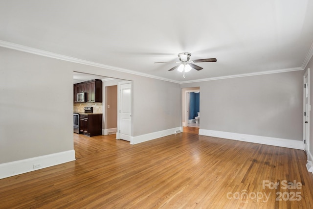 500 Peigler St NW Unit 1 & 2, Concord, NC 28027 - unfurnished living room with ceiling fan, light wood-style flooring, baseboards, and crown molding