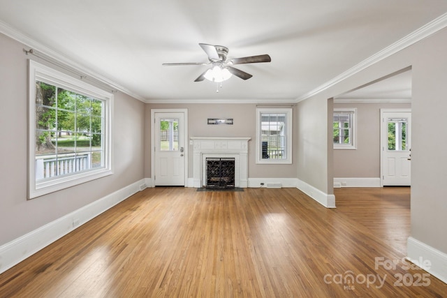 500 Peigler St NW Unit 1 & 2, Concord, NC 28027 - unfurnished living room with ceiling fan, wood finished floors, baseboards, a fireplace with flush hearth, and plenty of natural light